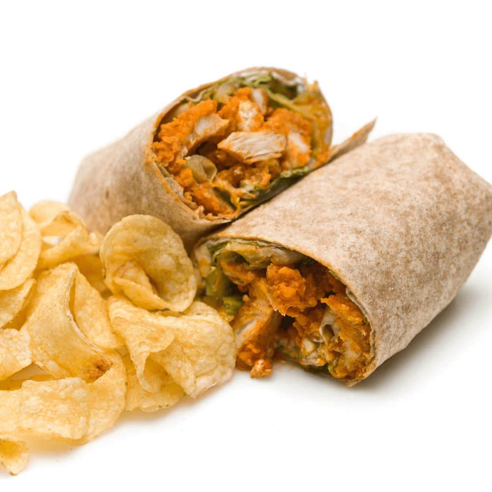 Buffalo chicken wrap cut in half on white background with potato chips.