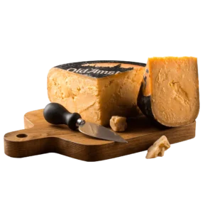 A portion of Gouda cheese on a serving board. 