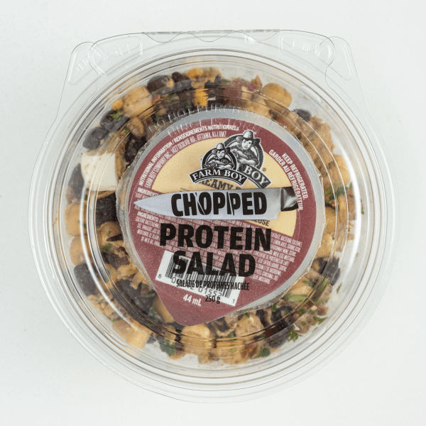 Farm Boy™ Chopped Protein Salad container. the salad has black beans, egg, and cheddar cheese.