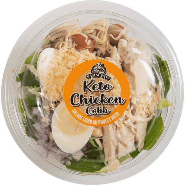 Fresh salad: Farm Boy™ Keto Chicken Cobb Salad. the salad has sliced hard boiled eggs, shredded chicken, chopped red onion, and shredded cheese.