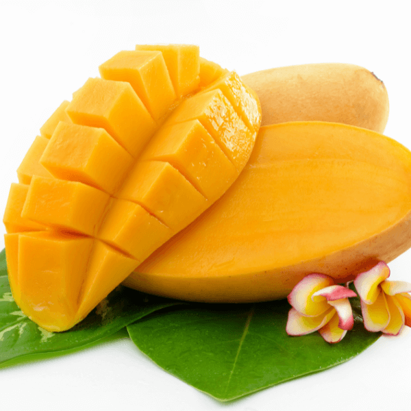 Sliced mango on white background with leaf and flower.