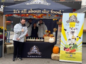 Farm Boy employees posing for a photo with their event table.