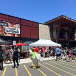 Large crowd of Farm Boy customers gather outside a store to celebrate Canada's Day.