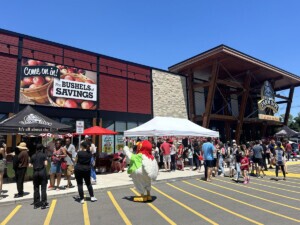 Large crowd of Farm Boy customers gather outside a store to celebrate Canada's Day.