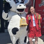 Farm Boy's Lulu stands beside Rosie MacLennan, a four-time Olympian, has she displays her medals during a meet and greet at the Canada Day celebrations.