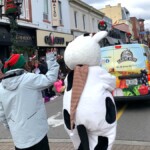 Farm Boy team and Lulu walking in the parade. 