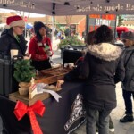 Farm Boy stand offering free samples to customers.