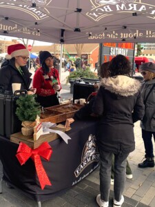 Farm Boy stand offering free samples to customers.