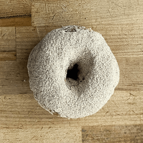 cinnamon sugar donut on wood background