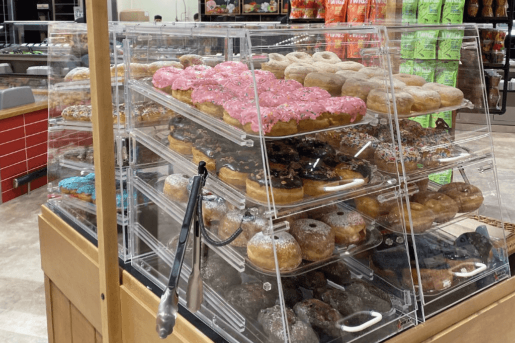 display of Harry and Heels donuts in clear case at Farm Boy store